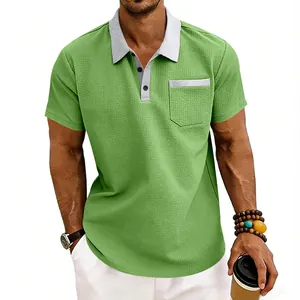 Close-up of men's green waffle knit polo shirt with contrast grey collar and pocket