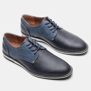 Detailed view of fashionable navy men's casual dress shoes with patchwork design
