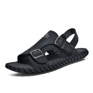 Close-up of black men's summer sandal with metal buckles and soft sole
