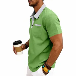 Detailed view of green waffle knit men's polo shirt with grey contrast collar and pocket.