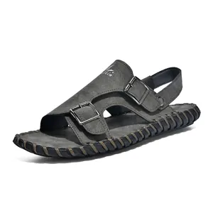 Close-up side view of dark grey men's summer sandal with adjustable double buckles