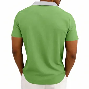 Back view detail of a green waffle knit polo shirt with grey contrast collar design