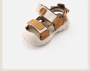 Detailed side view of stylish toddler summer sandals with durable tan straps and soft soles