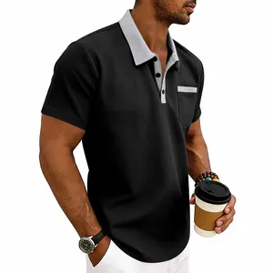 Detail of men's black waffle knit polo shirt with contrasting grey collar and pocket trim