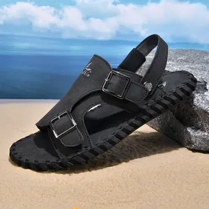 Detailed view of black men's leather beach sandals with buckle and hand-stitched sole