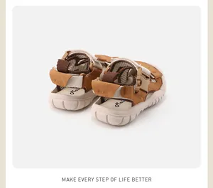 Rear view of children's summer sandals with brown straps and soft anti-slip beige soles.