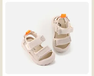 Detailed top-down view of durable beige children's sandals with non-slip rubber soles