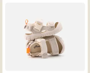 Detailed view of beige children's outdoor sandals with soft soles and buckle straps