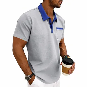 Detail showing waffle knit texture and contrast blue collar on grey men's polo shirt