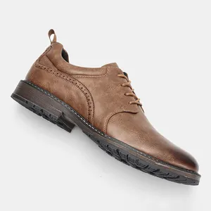 Side view of classic brown men's brogue dress shoe with burnished leather finish