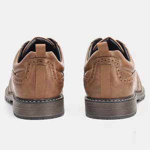 Detailed back view of men's brown retro brogue leather shoes showing fine texture.