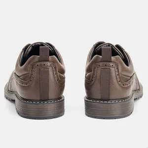 Rear view detail of men's brown leather dress shoes with burnished finish and pull tab