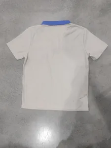 Detailed back view of a men's casual waffle knit polo shirt with contrast blue collar