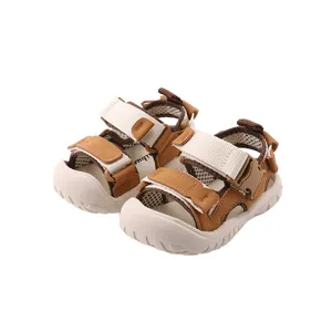Infant children's outdoor summer sandals with soft non-slip soles in brown and white