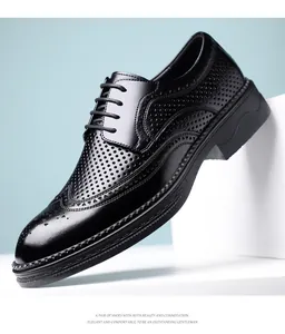Close-up of black Brogue leather shoes with hollow-out perforation and crocodile pattern details