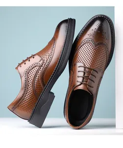 Close-up of brown leather Brogue shoes with hollow wingtip perforation details