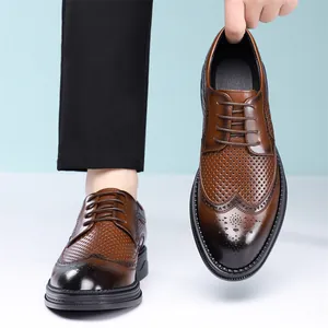 Classic brown men's brogue shoes featuring perforated wingtip design and thick soles