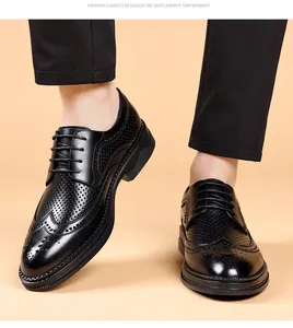 Detail of black brogue shoes with hollow out patterns for men's business fashion