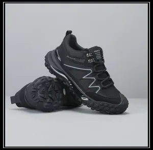 Professional black men's outdoor hiking shoes showing rugged non-slip rubber outsole detail