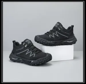 Detailed side view of black breathable men's outdoor hiking shoes with non-slip sole