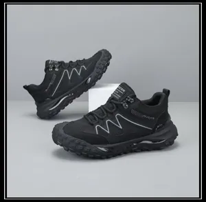 Detailed side view of black all-terrain outdoor hiking shoes with thick lugged soles