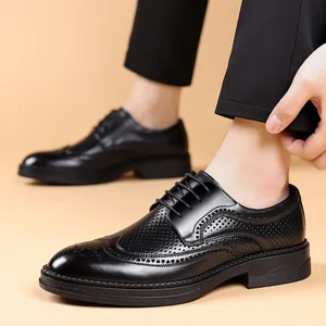 Elegant black brogue shoes with carved details and crocodile texture for business