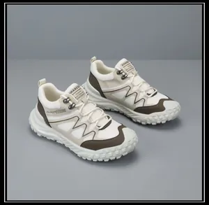 Detail of beige men's outdoor sports shoes featuring breathable mesh and rugged soles