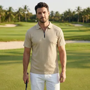 High-quality detail of men's beige knit texture polo shirt with front zipper on golf course.