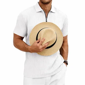 Close-up detail of white men's leisure polo shirt featuring vertical knit texture and zip