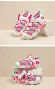 Detailed macro shot of white and pink children's wading sandals with mesh and Velcro