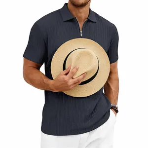 Detailed view of men's navy blue knit polo shirt with vertical texture and zipper