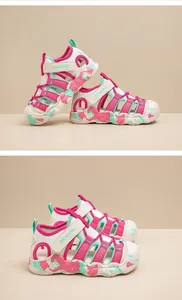 Detail view showing pink and mint green children's outdoor sandals with protective closed toe