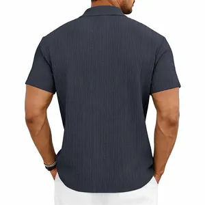 Detailed back view of men's dark grey textured knit polo shirt with vertical cable pattern