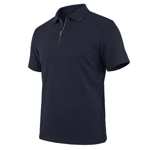 Close-up of navy blue men's knit polo shirt featuring vertical texture and zipper placket.