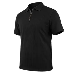 Detailed view of men's black knit polo shirt with vertical texture and zipper placket