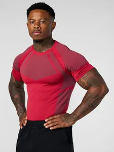 Close-up view of men's red athletic compression t-shirt showing detailed fabric texture