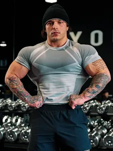 Detailed shot of grey men's compression t-shirt showing muscle fit and mesh design.