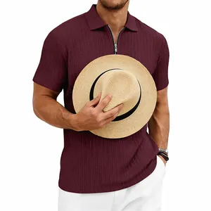 Close-up detail of men's burgundy knit textured polo shirt featuring a stylish zipper neck
