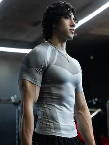 Close-up of gray men's short-sleeved compression T-shirt in gym setting