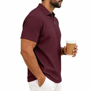 Men's burgundy short sleeve zip polo shirt with textured knit for casual golf wear.