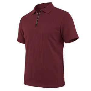 Detailed macro view of men's burgundy textured knit polo shirt featuring a sleek zipper placket