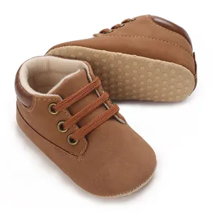 Detailed view of brown PU baby walking shoes showing the high-top design and soft non-slip sole