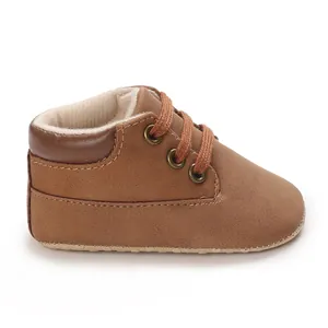 Close-up of brown PU leather baby high-top pre-walker shoe with soft sole