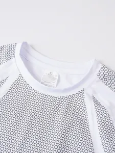 Close-up of men's athletic T-shirt neckline showing fabric pattern and care label
