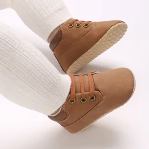 Detailed close-up of brown soft-sole PU leather baby walking shoes for infants
