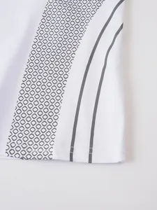 Detailed macro view of white athletic compression T-shirt with grey geometric pattern