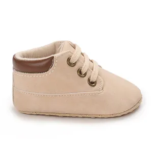 Detailed side view of a beige lace-up soft sole high-top baby infant walker shoe