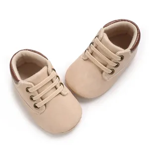Detailed view of beige soft-sole baby walking shoes with comfortable brown trim
