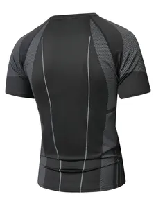 Back detail of men's black compression shirt with grey honeycomb pattern and vertical piping