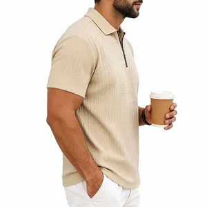 Detail view of beige men's textured knit polo shirt featuring a quarter-zip collar